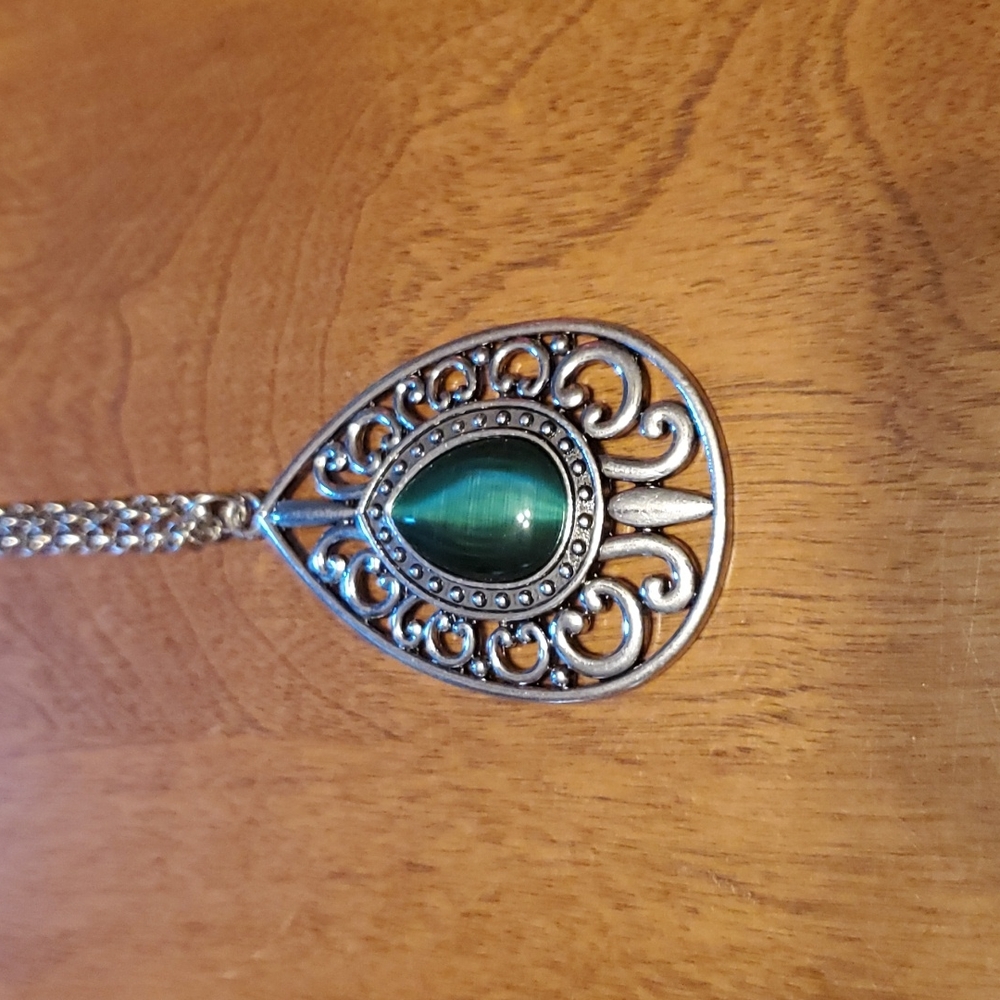 Paparazzi long silver necklace with green gemstone.